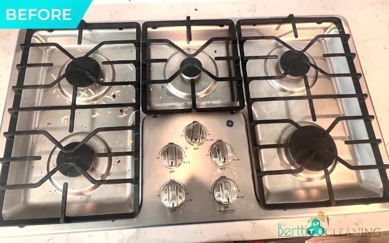 Before: Stainless gas cooktop with five burners